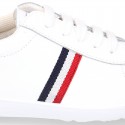 Washable leather OKAA kids School tennis shoes with laces and flag design.