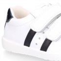 Washable leather OKAA kids School tennis shoes laceless, stripes design and reinforced toe cap.