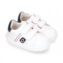 White color OKAA FLEX tennis kids shoes laceless.