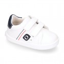 White color OKAA FLEX tennis kids shoes laceless.