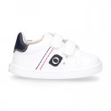 White color OKAA FLEX tennis kids shoes laceless.