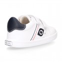 White color OKAA FLEX tennis kids shoes laceless.