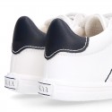 White color OKAA FLEX tennis kids shoes laceless.