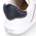 White color OKAA FLEX tennis kids shoes laceless.