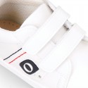 White color OKAA FLEX tennis kids shoes laceless.