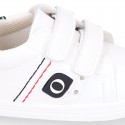 White color OKAA FLEX tennis kids shoes laceless.