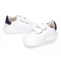 White color OKAA FLEX tennis kids shoes laceless.