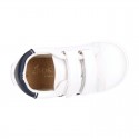 White color OKAA FLEX tennis kids shoes laceless.