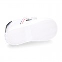 White color OKAA FLEX tennis kids shoes laceless.