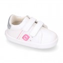 White color OKAA FLEX girl tennis shoes laceless.