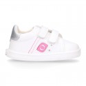 White color OKAA FLEX girl tennis shoes laceless.