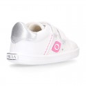 White color OKAA FLEX girl tennis shoes laceless.