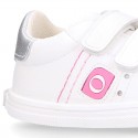 White color OKAA FLEX girl tennis shoes laceless.