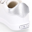 White color OKAA FLEX girl tennis shoes laceless.