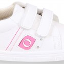 White color OKAA FLEX girl tennis shoes laceless.