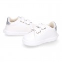 White color OKAA FLEX girl tennis shoes laceless.