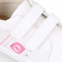 White color OKAA FLEX girl tennis shoes laceless.