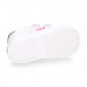 White color OKAA FLEX girl tennis shoes laceless.