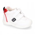 White color OKAA FLEX tennis kids shoes laceless and with toe cap.