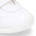 White color OKAA FLEX tennis kids shoes laceless and with toe cap.