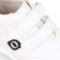 White color OKAA FLEX tennis kids shoes laceless and with toe cap.