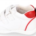 White color OKAA FLEX tennis kids shoes laceless and with toe cap.