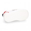 White color OKAA FLEX tennis kids shoes laceless and with toe cap.