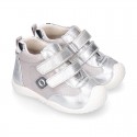 Silver color OKAA FLEX tennis girl shoes laceless and with toe cap.