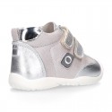 Silver color OKAA FLEX tennis girl shoes laceless and with toe cap.