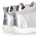 Silver color OKAA FLEX tennis girl shoes laceless and with toe cap.