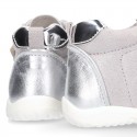 Silver color OKAA FLEX tennis girl shoes laceless and with toe cap.