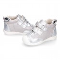 Silver color OKAA FLEX tennis girl shoes laceless and with toe cap.