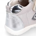 Silver color OKAA FLEX tennis girl shoes laceless and with toe cap.