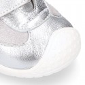 Silver color OKAA FLEX tennis girl shoes laceless and with toe cap.