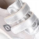 Silver color OKAA FLEX tennis girl shoes laceless and with toe cap.