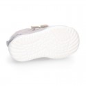 Silver color OKAA FLEX tennis girl shoes laceless and with toe cap.