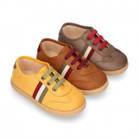 Trendy colors autumn winter canvas kids tennis shoes with flag design.