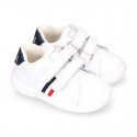 Washable leather OKAA Little kids School tennis shoes laceless and with side flag design.