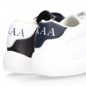 Washable leather OKAA Little kids School tennis shoes laceless and with side flag design.