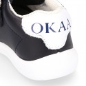 Washable leather OKAA Little kids School tennis shoes laceless and with side flag design.