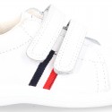 Washable leather OKAA Little kids School tennis shoes laceless and with side flag design.