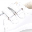 Washable leather OKAA Little kids School tennis shoes laceless and with side flag design.