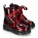 ROCK style patent finish girl boots with silk ties closure.