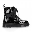 ROCK style patent finish girl boots with silk ties closure.