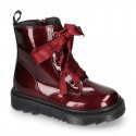 ROCK style patent finish girl boots with silk ties closure.