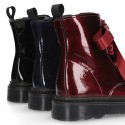 ROCK style patent finish girl boots with silk ties closure.