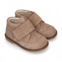 Suede Leather kids booties with chopped design and laceless.