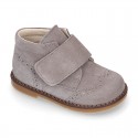 Suede Leather kids booties with chopped design and laceless.