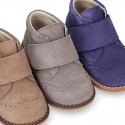 Suede Leather kids booties with chopped design and laceless.