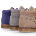 Suede Leather kids booties with chopped design and laceless.